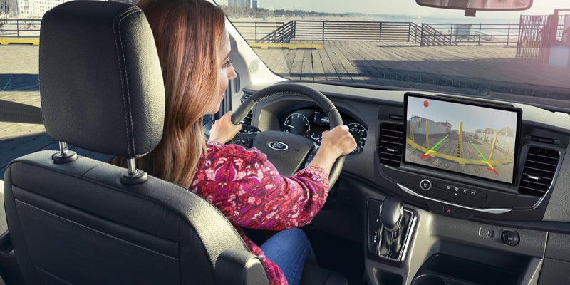 Photo of a person driving a 2024 Ford Transit