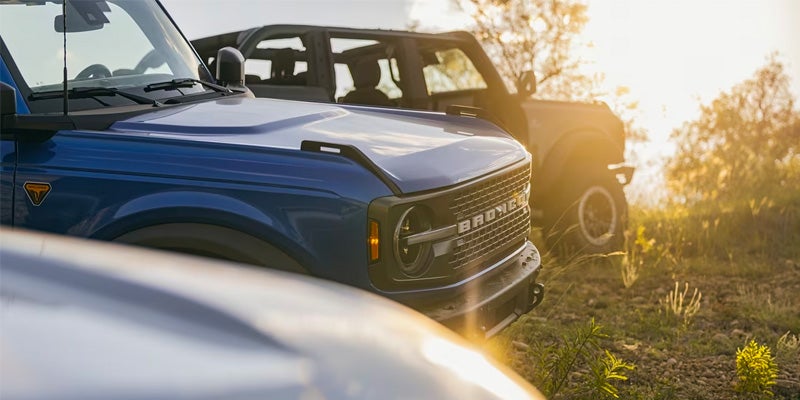 Close up view of 2 2024 Ford Bronco's parked next to each other