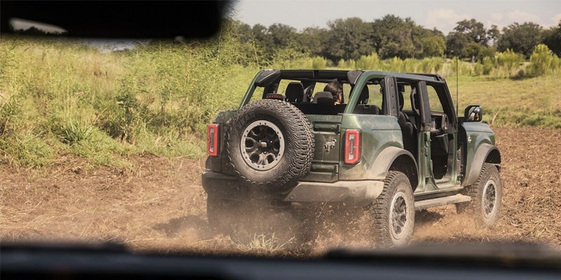 Rear view of a 2024 Ford Bronco parked in the grass