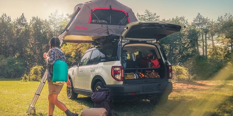 Photo of people camping with a 2024 Ford Bronco Sport
