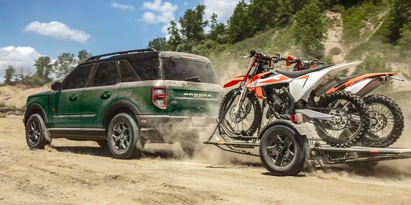 Photo of a 2024 Ford Bronco Sport towing dirt bikes
