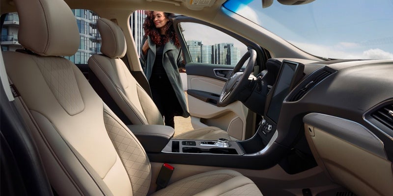 Interior view of a person getting into a 2024 Ford Edge