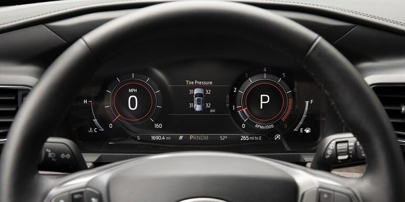 Close up view of the dashboard and steering wheel of a 2024 Ford Explorer