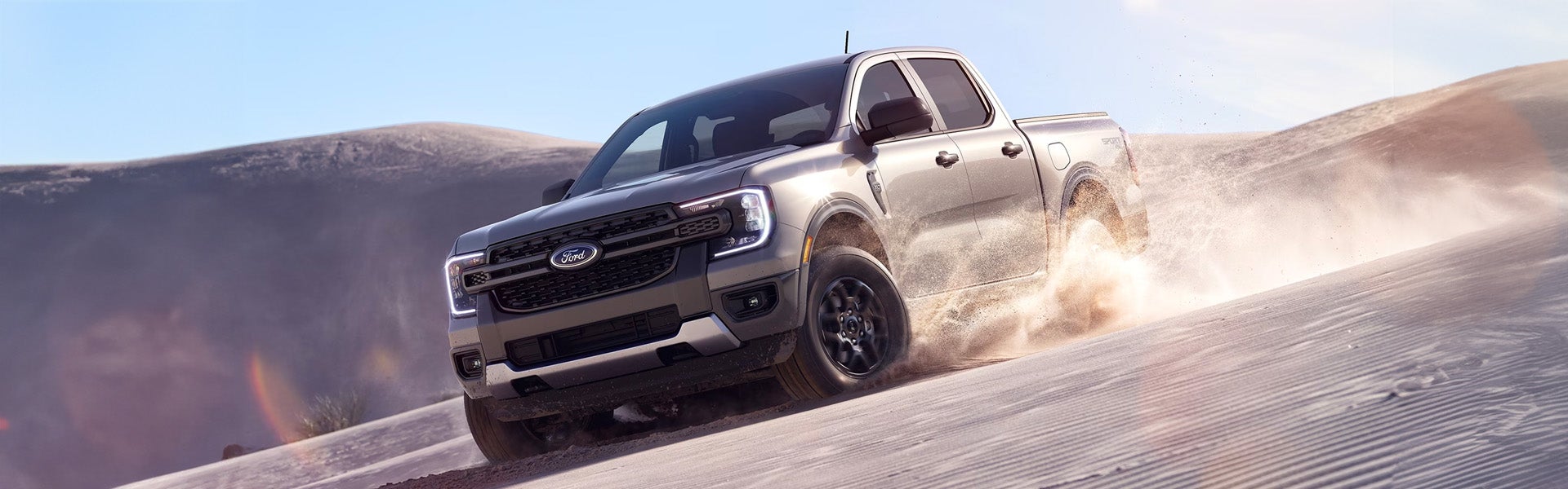 Photo of a 2024 Ford Ranger driving on a sand terrain