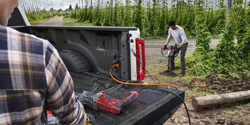 Photo of people powering their work equipment with a 2024 Ford Super Duty