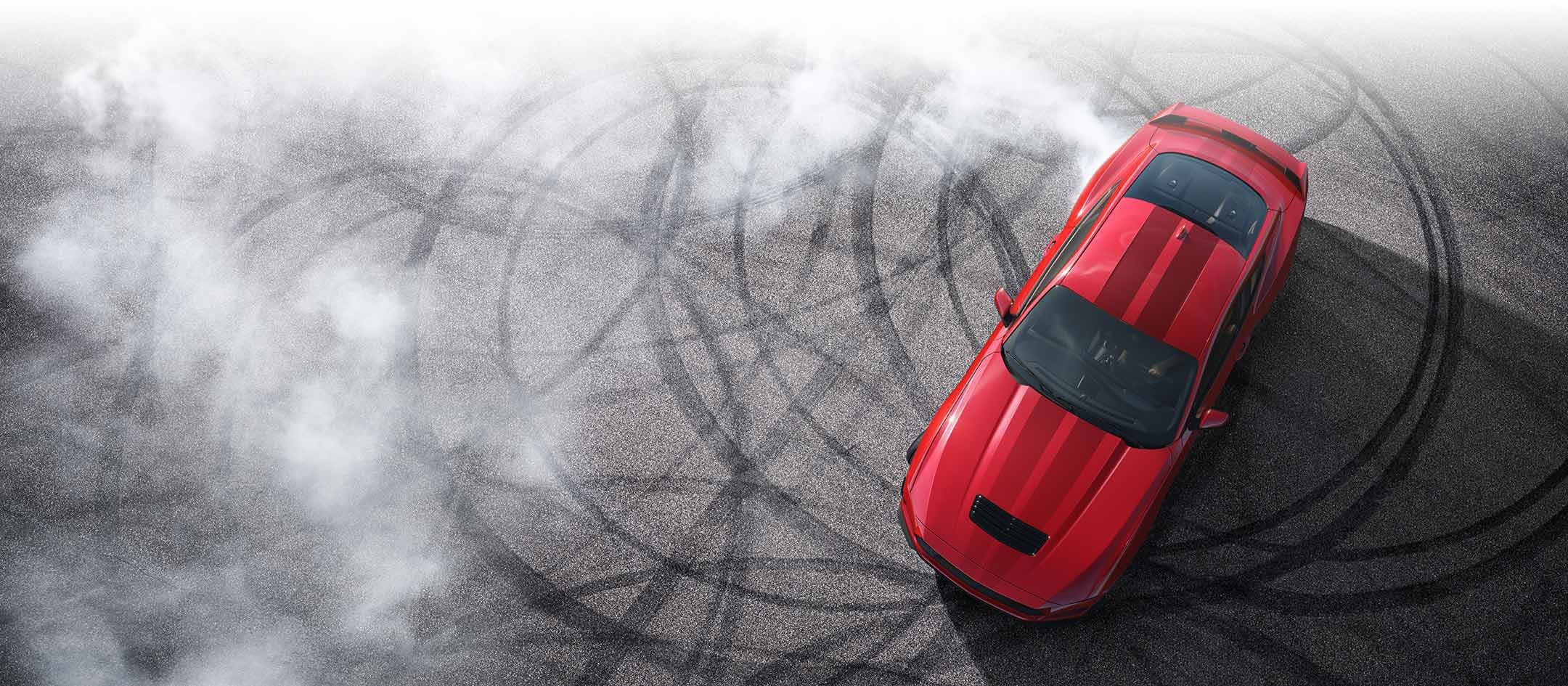 Overhead view of a 2024 Ford Mustang® model with tire tracks on pavement | Al Packer's White Marsh Ford in Middle River MD