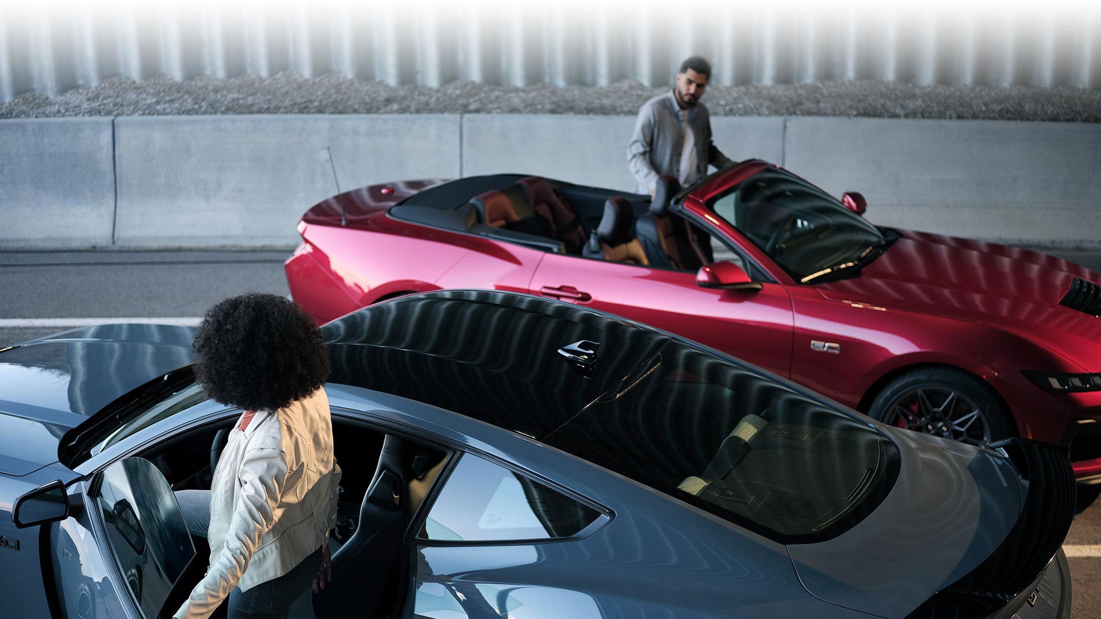 Two people exiting their parked 2024 Ford Mustang® coupe and convertible | Al Packer's White Marsh Ford in Middle River MD