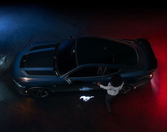 2024 Ford Mustang® Dark Horse™ model with a driver approaching the vehicle | Al Packer's White Marsh Ford in Middle River MD