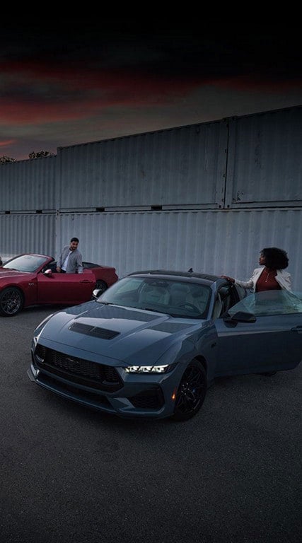 Two people exiting their parked 2024 Ford Mustang® coupe and convertible | Al Packer's White Marsh Ford in Middle River MD