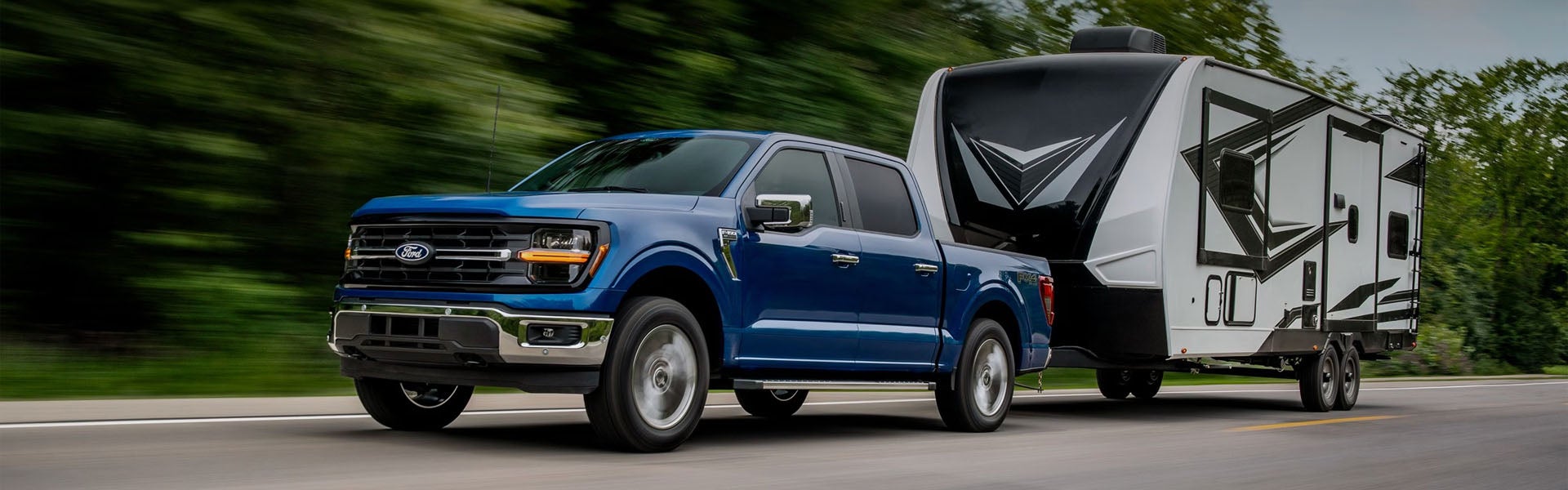 Photo of a 2025 Ford F-150 towing a trailer