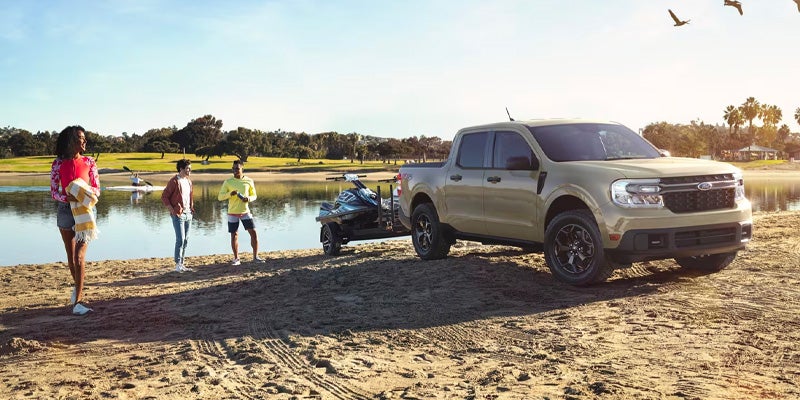 Photo of a 2025 Ford Maverick parked on sand by a body of water